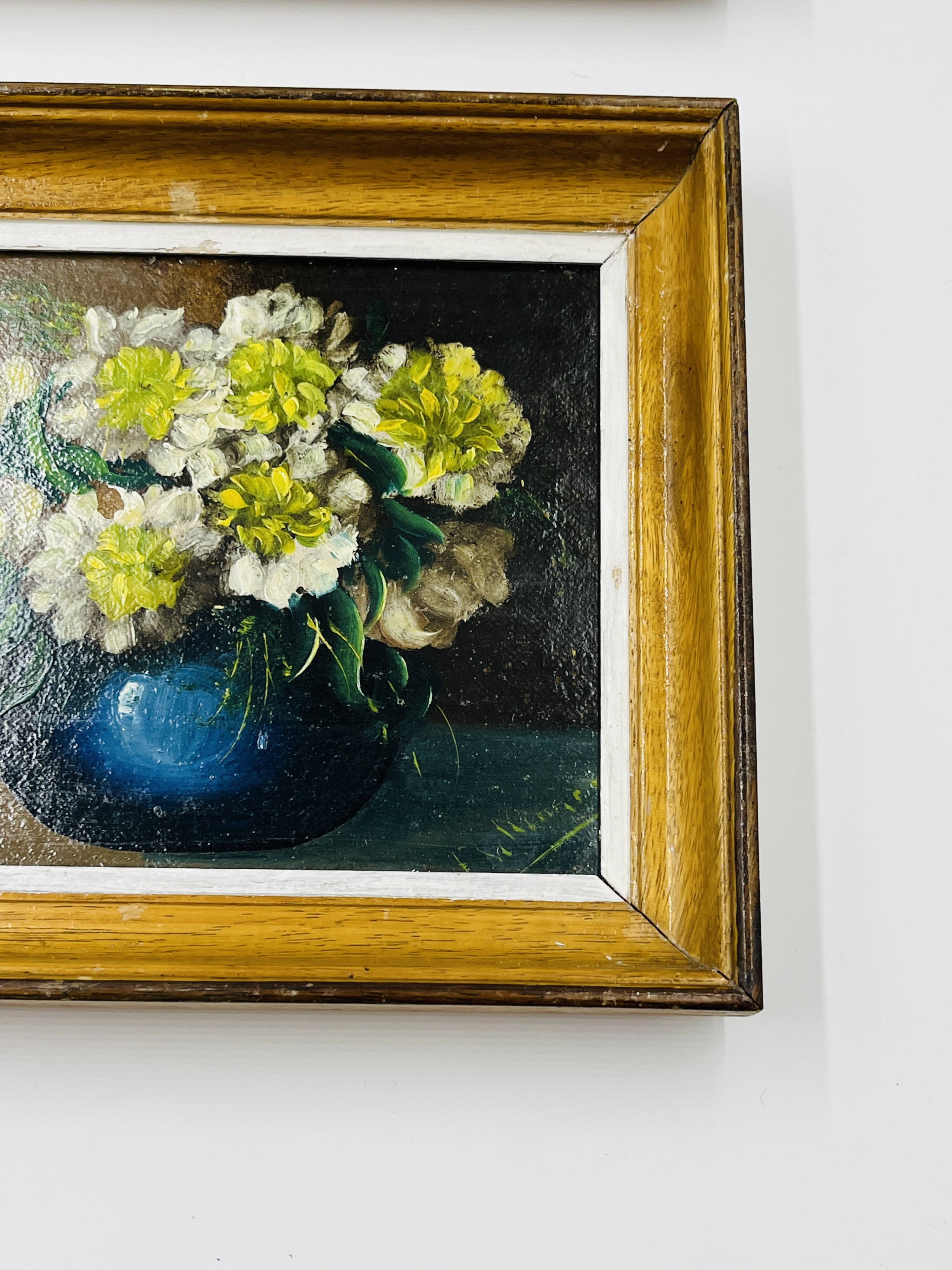 Pair of small framed vintage floral oils
