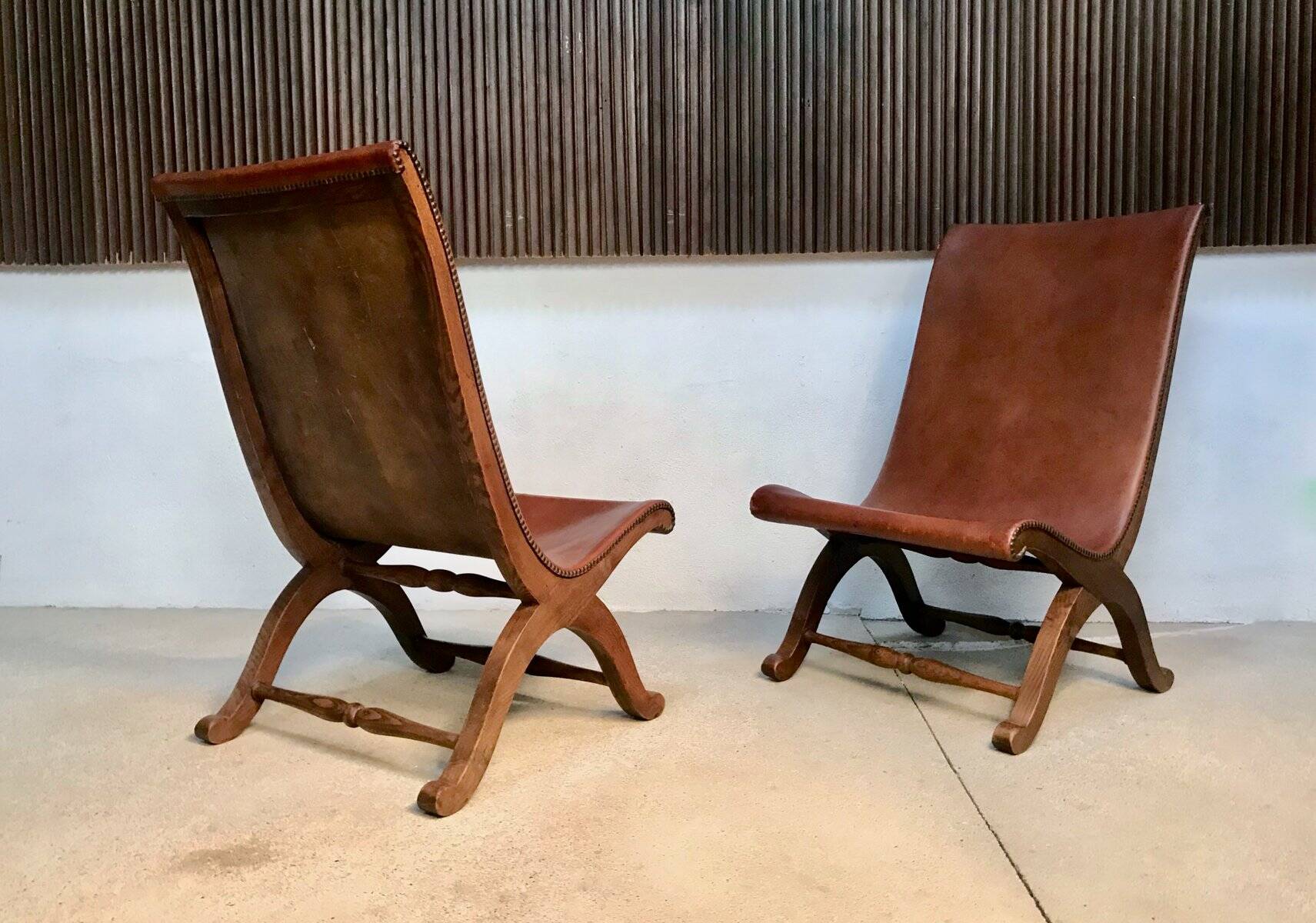 Set of 2 Spanish high-back leather slipper chairs by Pierre Lottier, 1950s