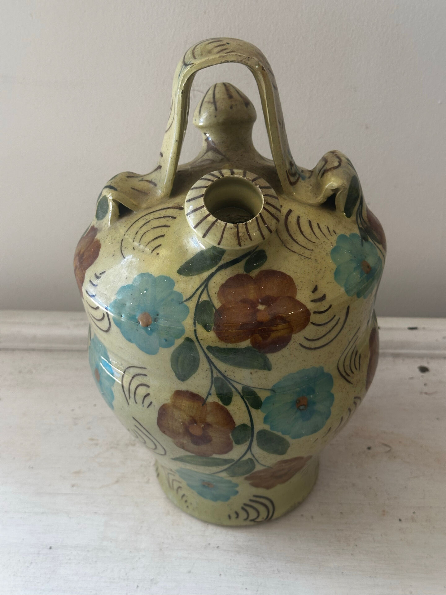 Mediterranean ceramic jug with floral decoration.