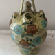 Mediterranean ceramic jug with floral decoration.