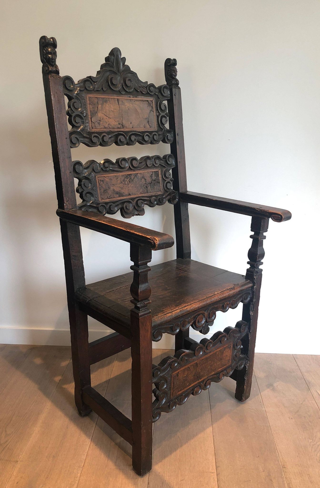 Set of an armchair and a pair of chairs in Italian Renaissance walnut