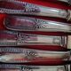 11 cheese knives in silver-filled metal and stainless steel.