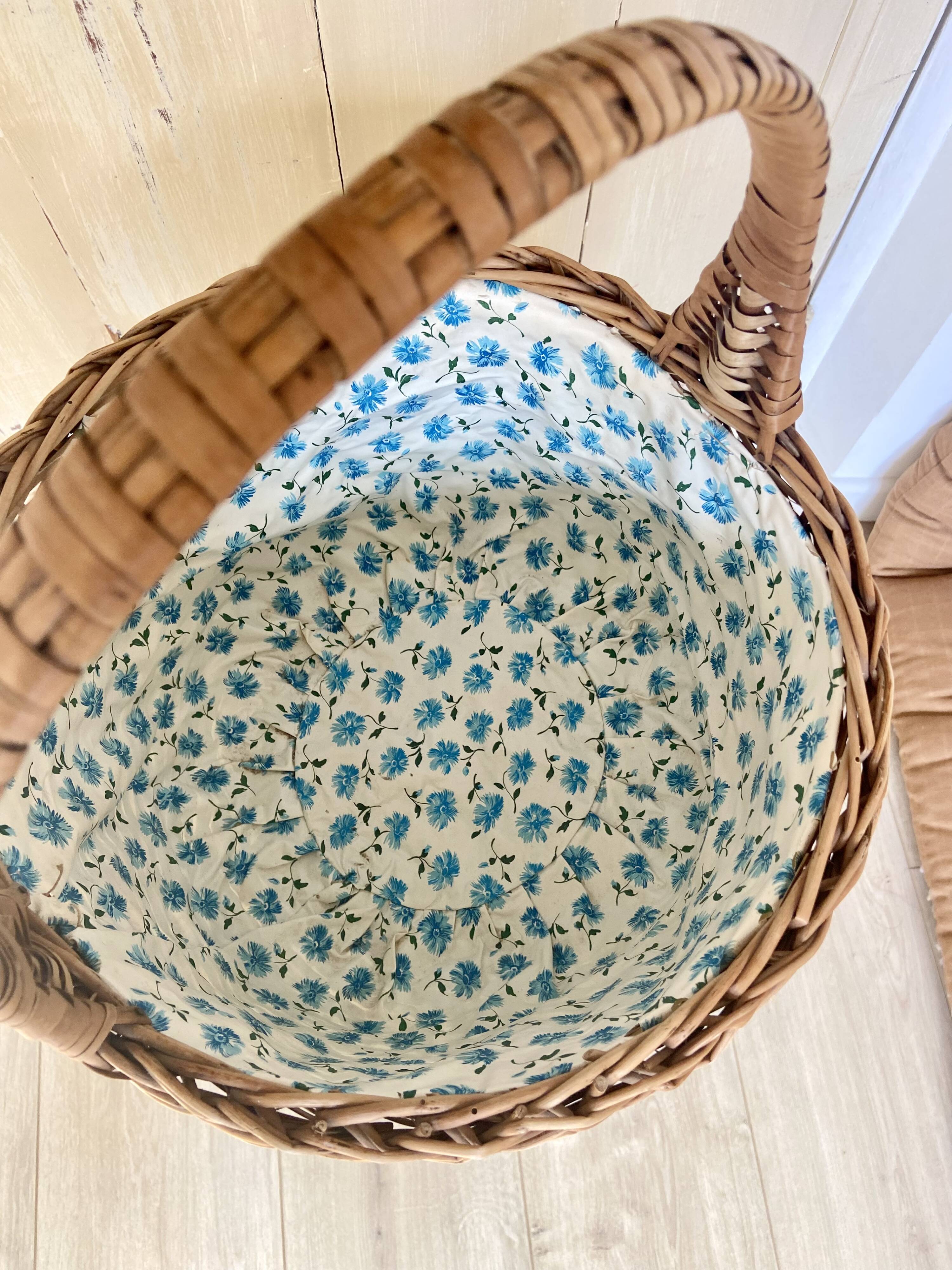 Wicker basket with waxed canvas blue flowers