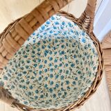 Wicker basket with waxed canvas blue flowers