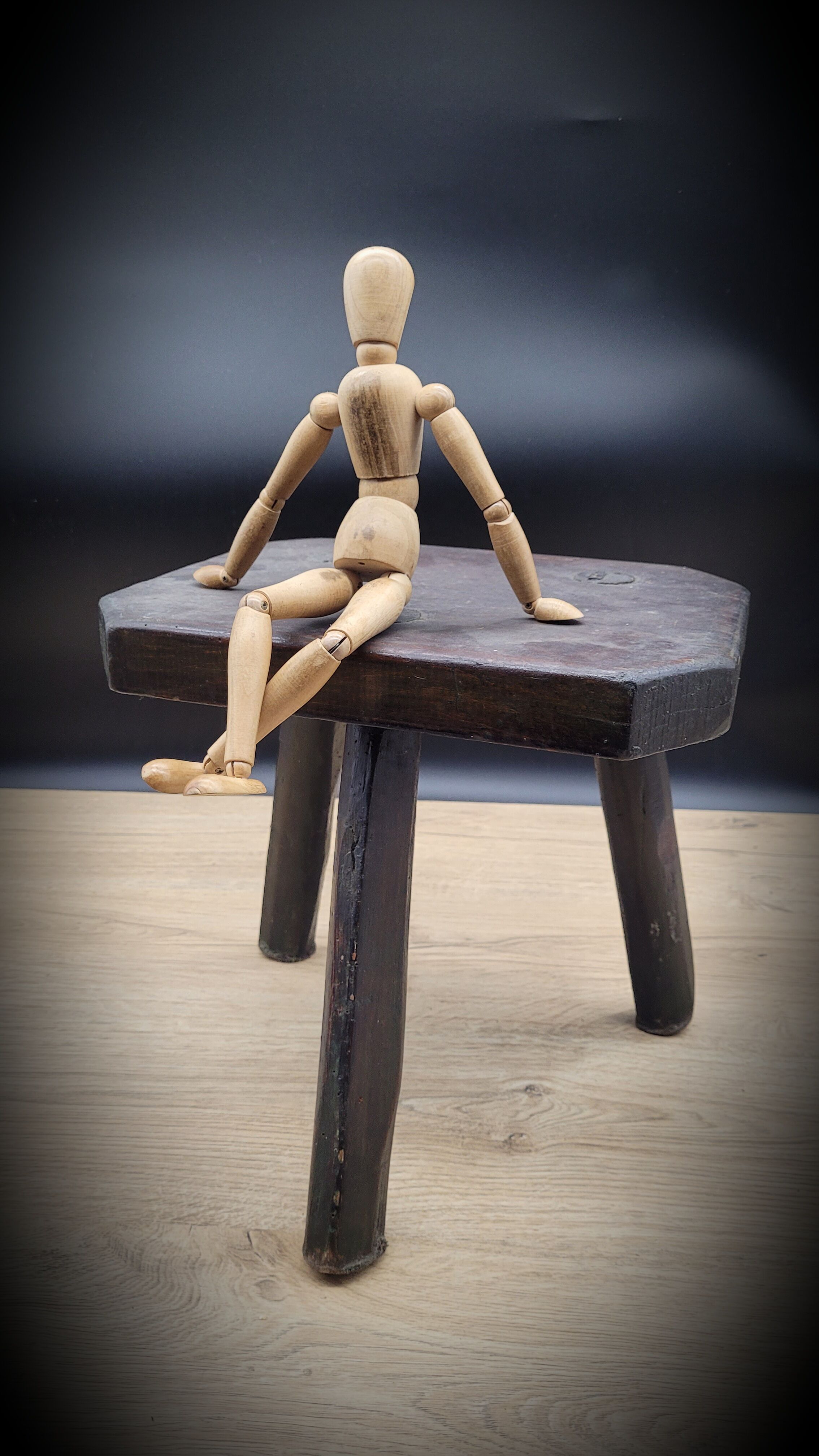 Dark octagon tripod stool