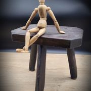 Dark octagon tripod stool