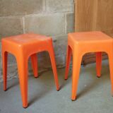 Pair of AMI stools in orange plastic