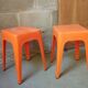 Pair of AMI stools in orange plastic