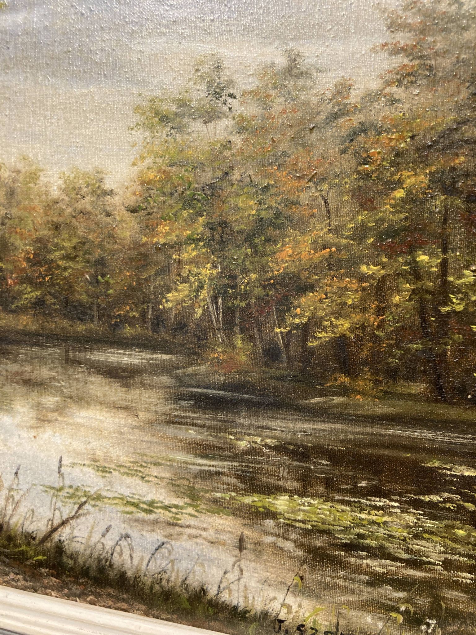 Peinture représentant un lac au milieu de la forêt