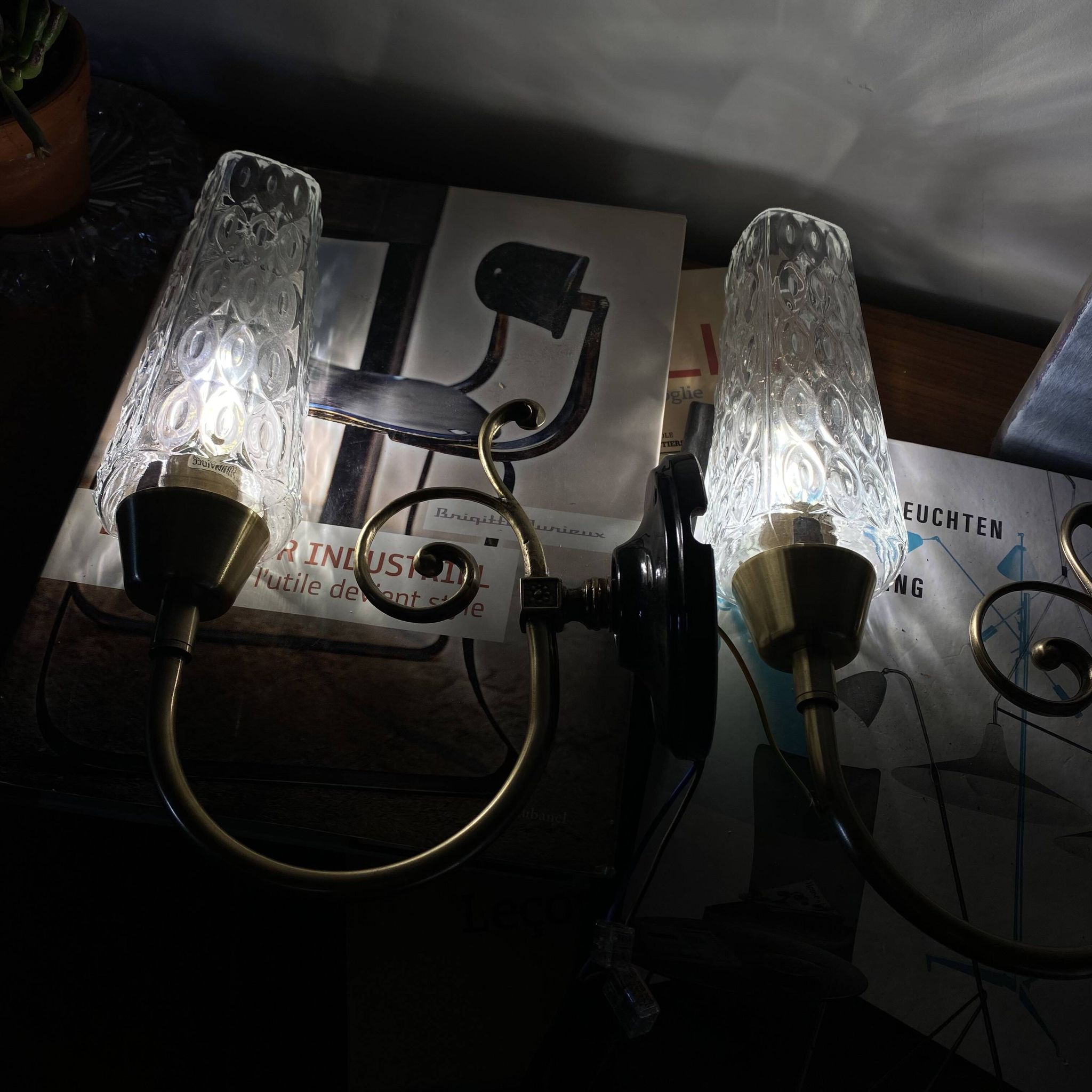 Pair of wall sconces in brass with square tulip glass shades.
