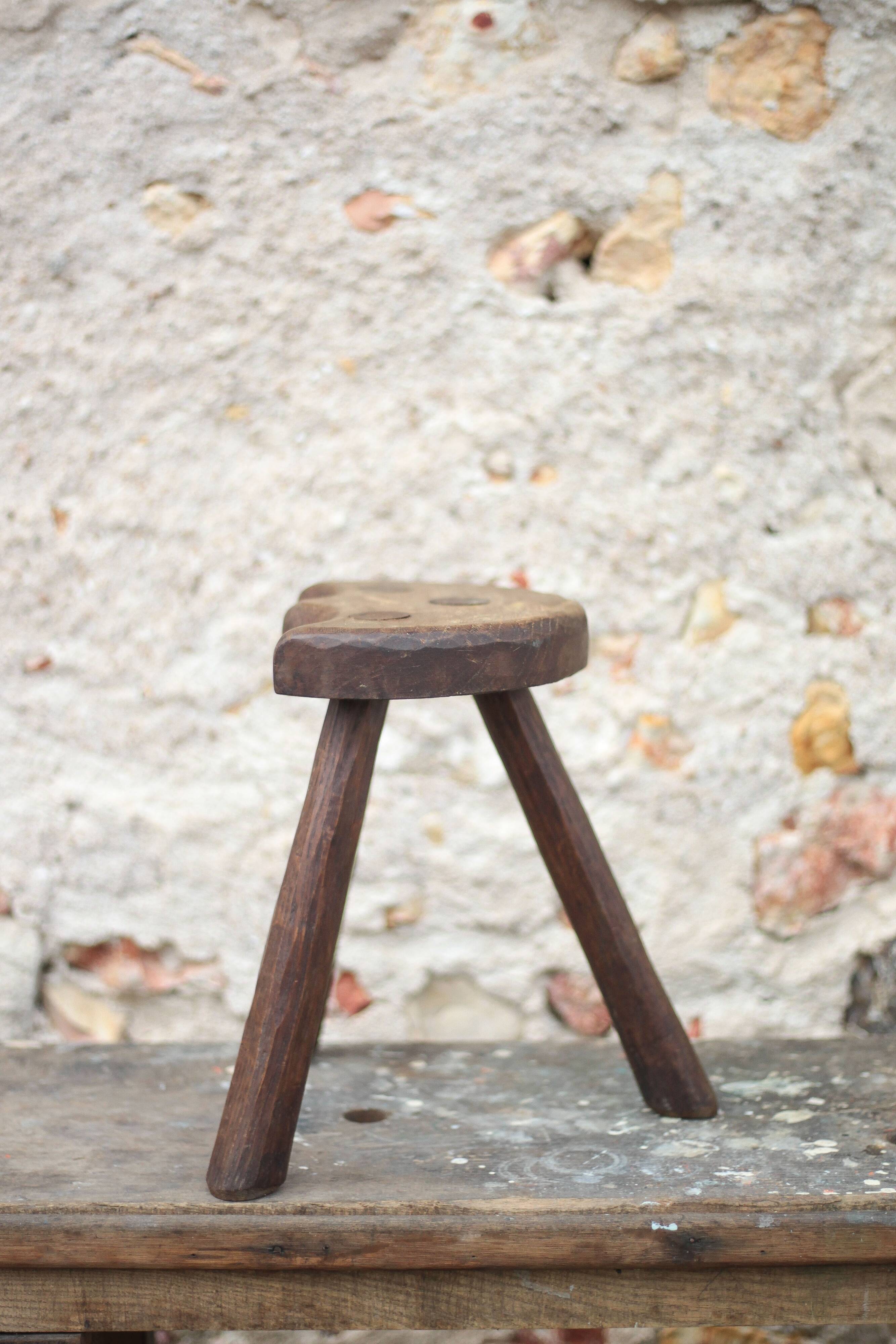 Vintage wooden tripod stool, mountain work, wabi-sabi, shepherd.