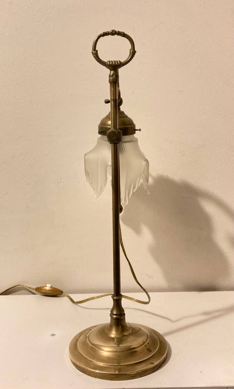 Brass table lamp with a glass shade