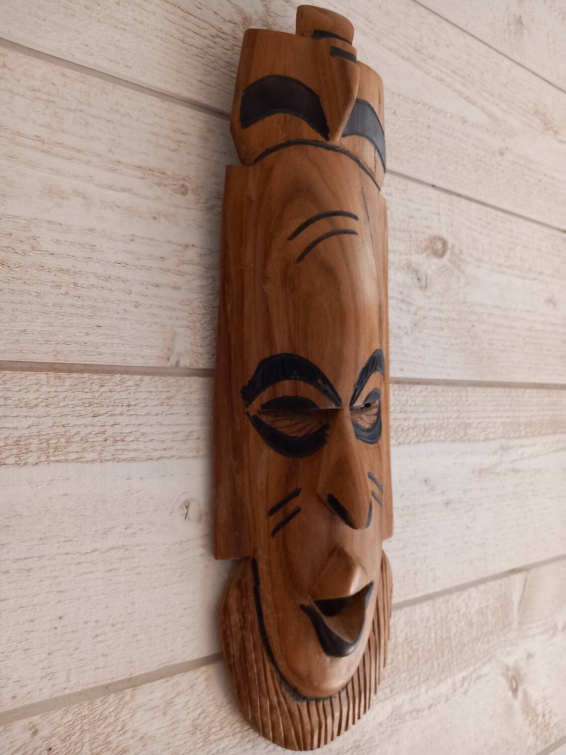 African mask in light wood