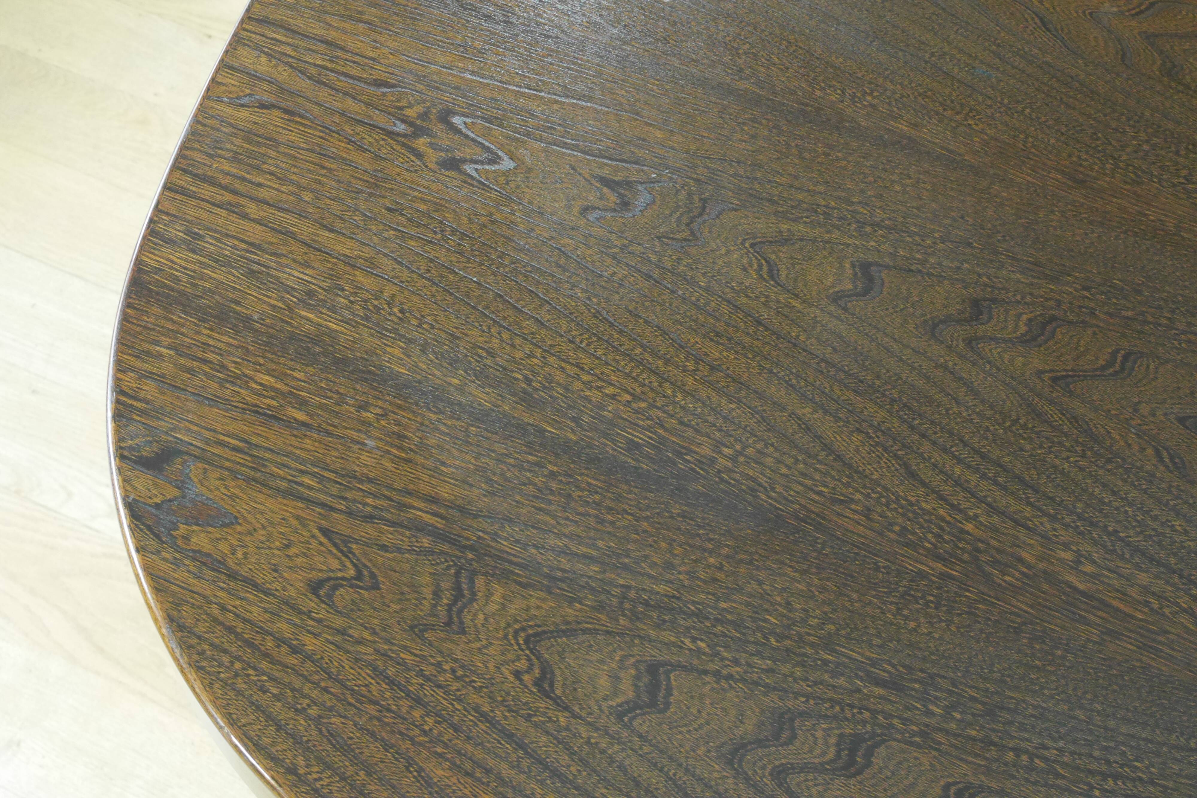 Oval elm table with extension cords