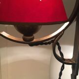Two wrought iron wall lights, fabric cable.