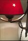 Two wrought iron wall lights, fabric cable.