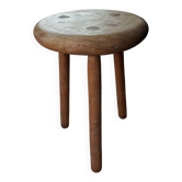 Old tripod stool in raw wood