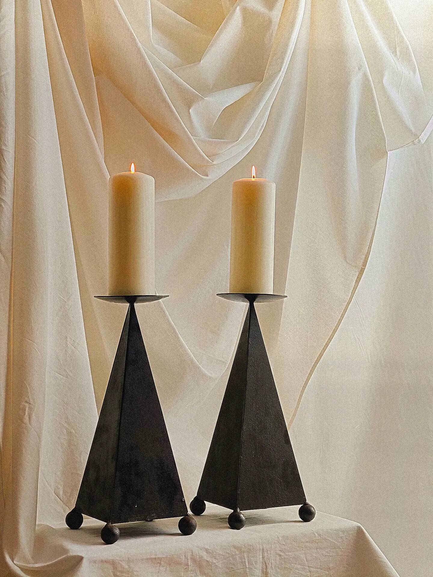 Pair of pyramid-shaped candlesticks in blackened metal (brutalism)