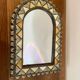 Oriental bone mirror