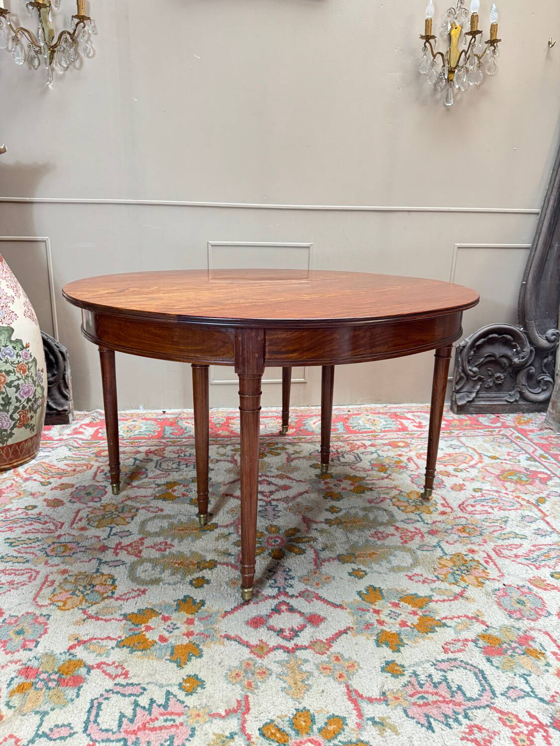 Dining table with a mahogany band in louis xvi style