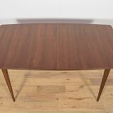 Extendable teak dining table in Mid-Century style from McIntosh, UK.