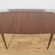 Extendable teak dining table in Mid-Century style from McIntosh, UK.