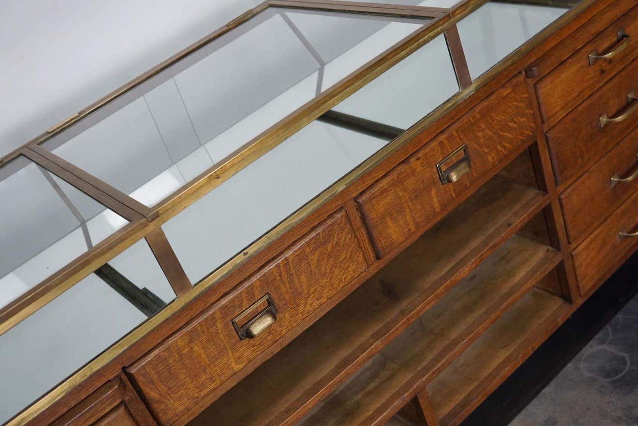 Counter or shop window in oak glass and brass France around 1920