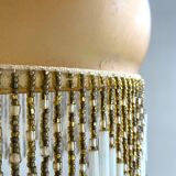 Amber polished glass and pearl suspension