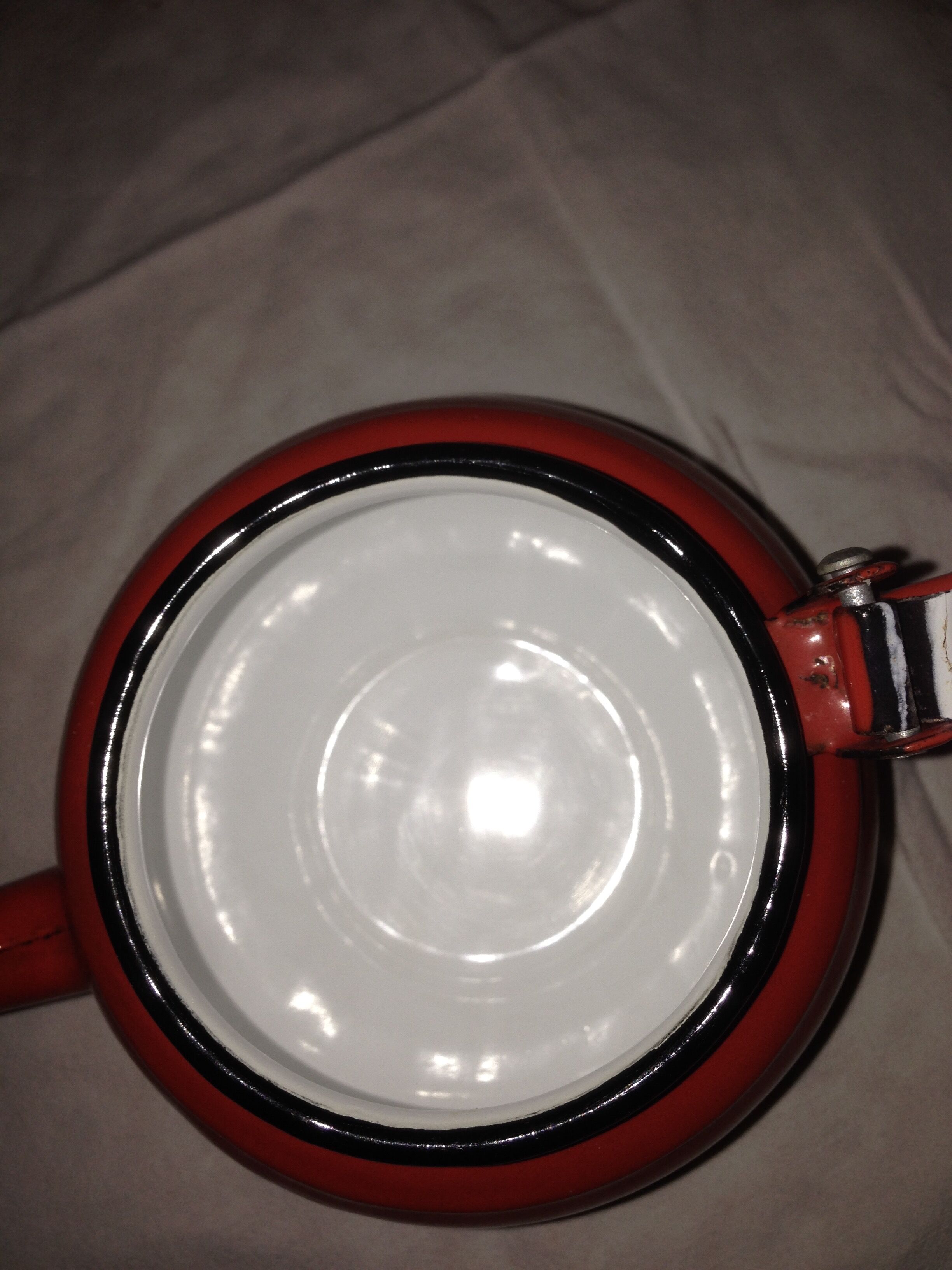 Small red metal teapot