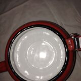 Small red metal teapot