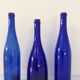 Decorative trio of old blue glass bottles