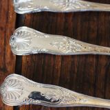 A set of 7 large metal shell spoons