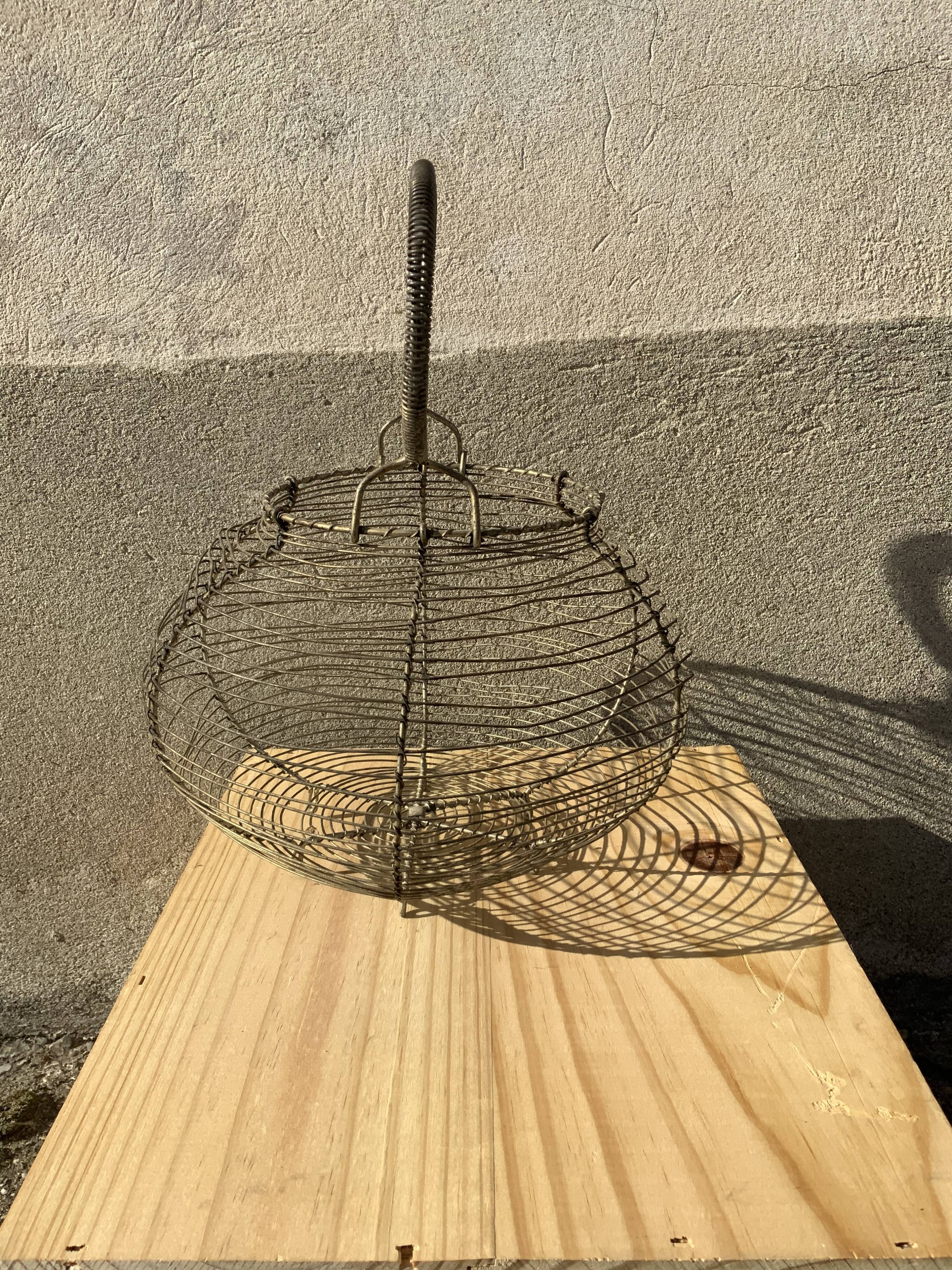 Vintage iron egg basket with hanse antique