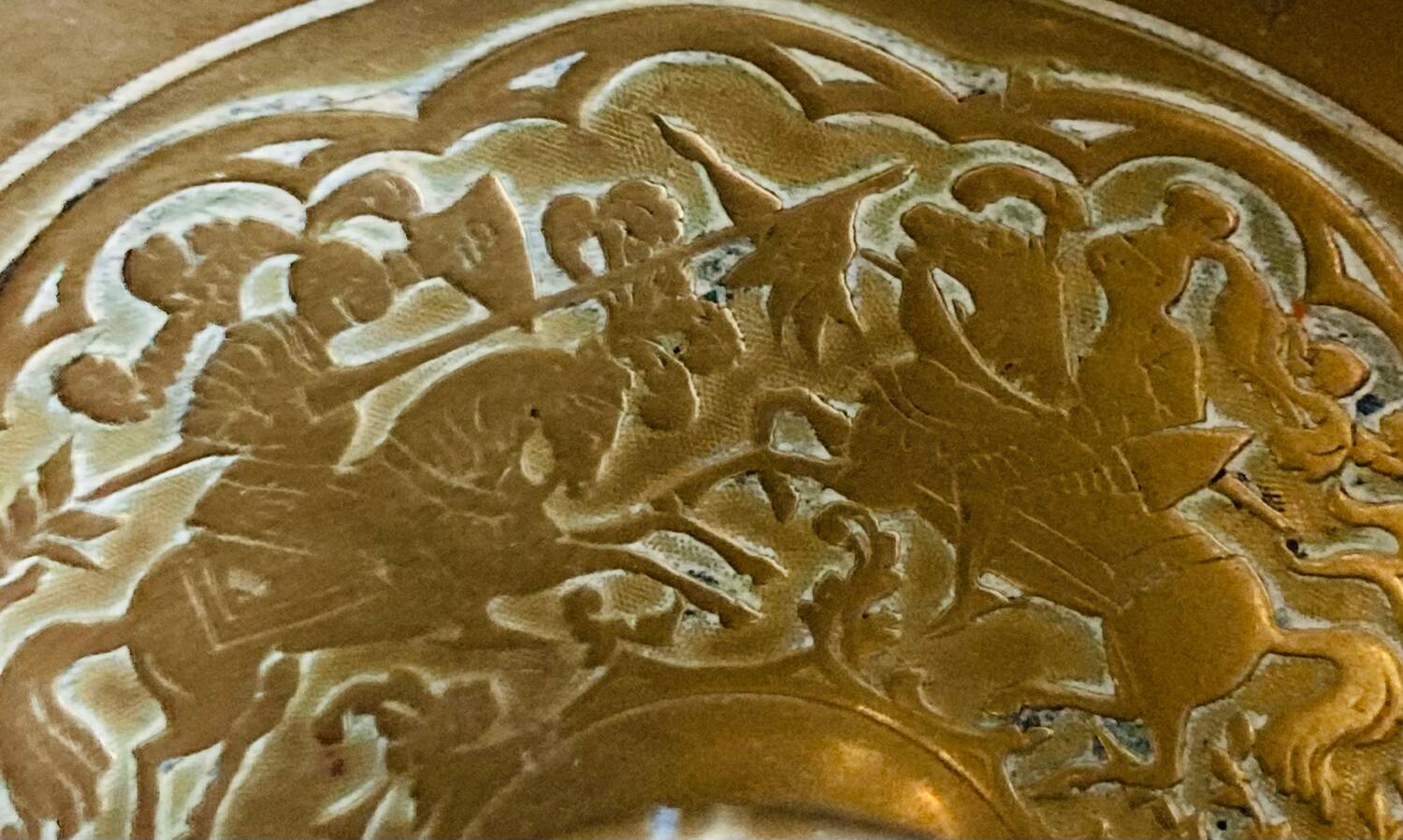 20th century chiseled brass socket candle holder representing Horsemen in armor