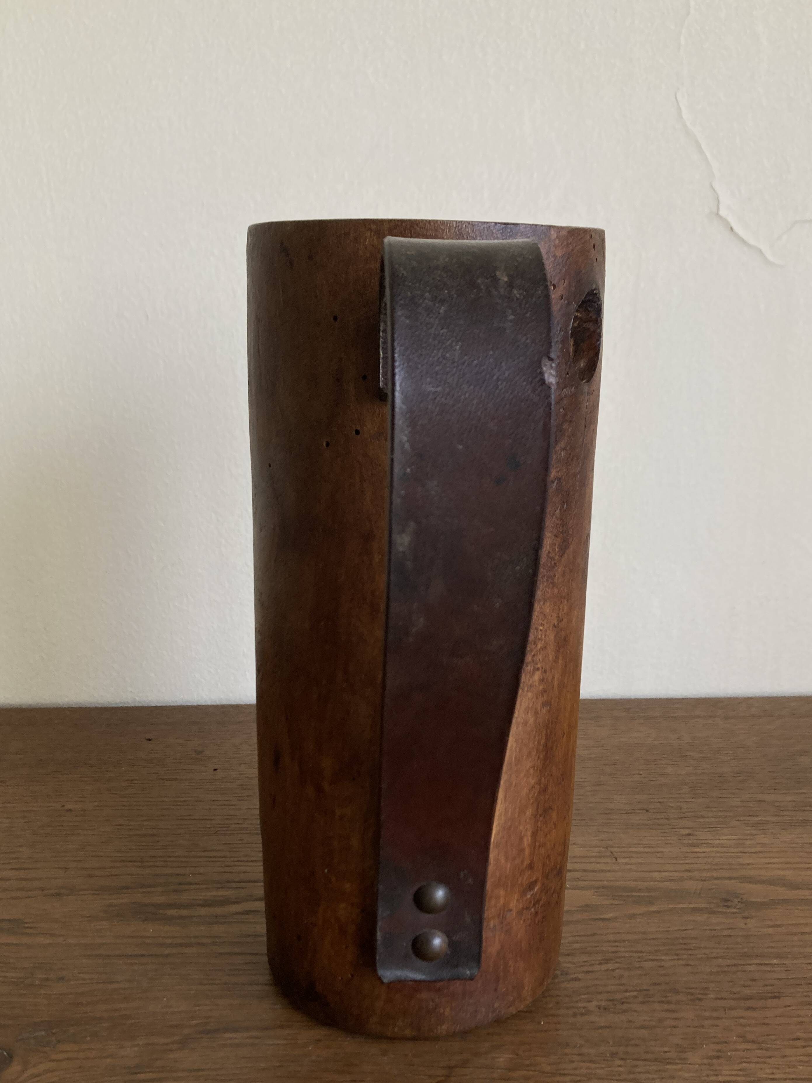 Mountain pitcher in monoxile wood and leather folk art