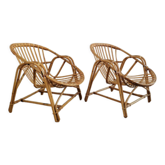 Duo de fauteuils coquille en rotin 1970