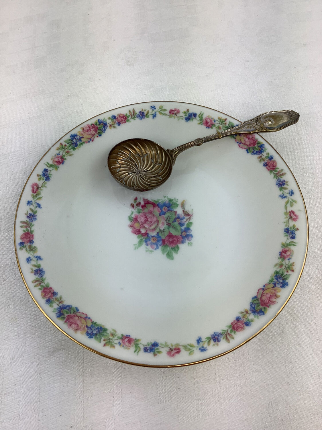 Old sprinkling spoon