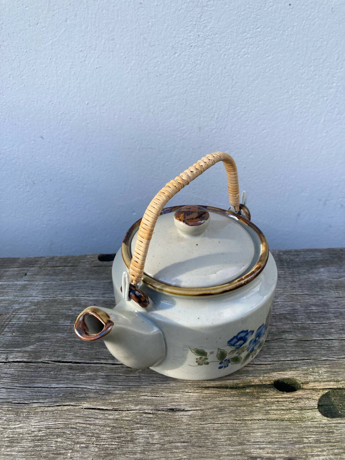 Chinese ceramic and rattan teapot