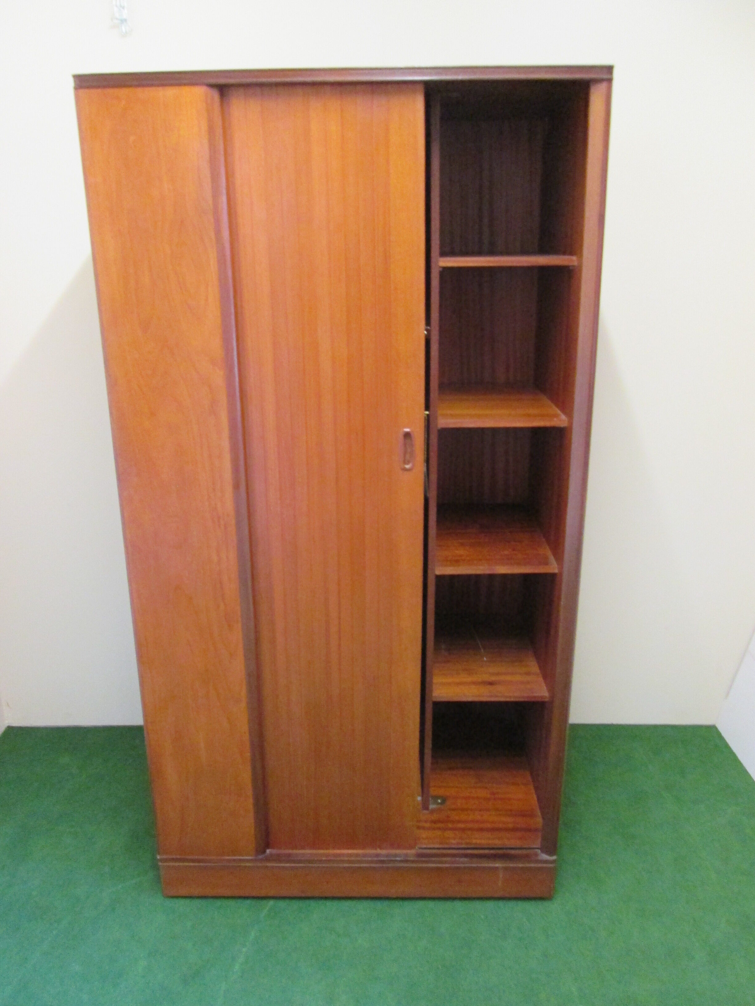 Teak cabinet with shuttered sliding door