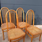 Set of 4 vintage Baumann chairs in honey wood and cane.
