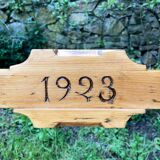 Old wooden bench with backrest, dated 1923