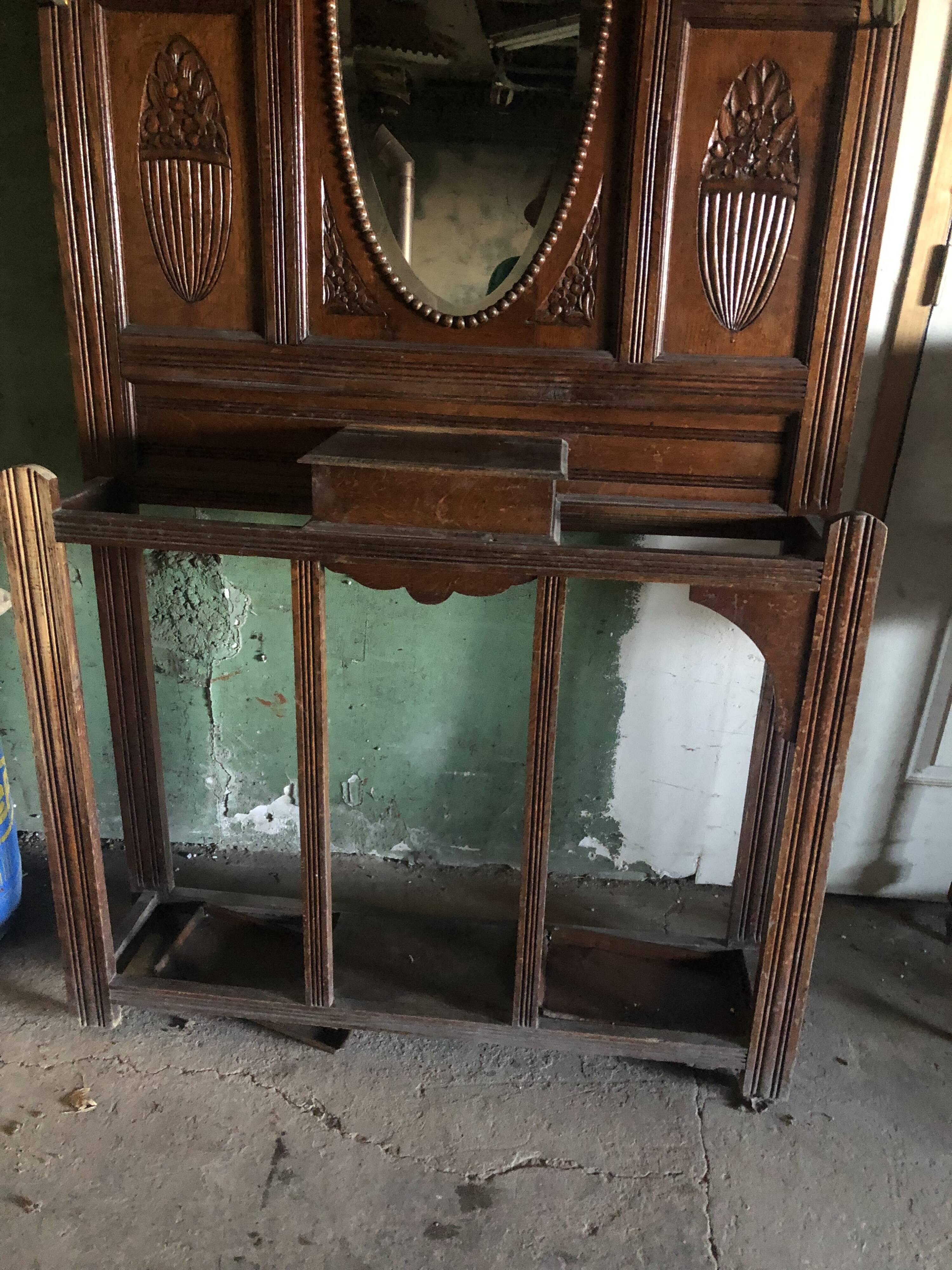 Very decorative coat rack with bevelled mirror.