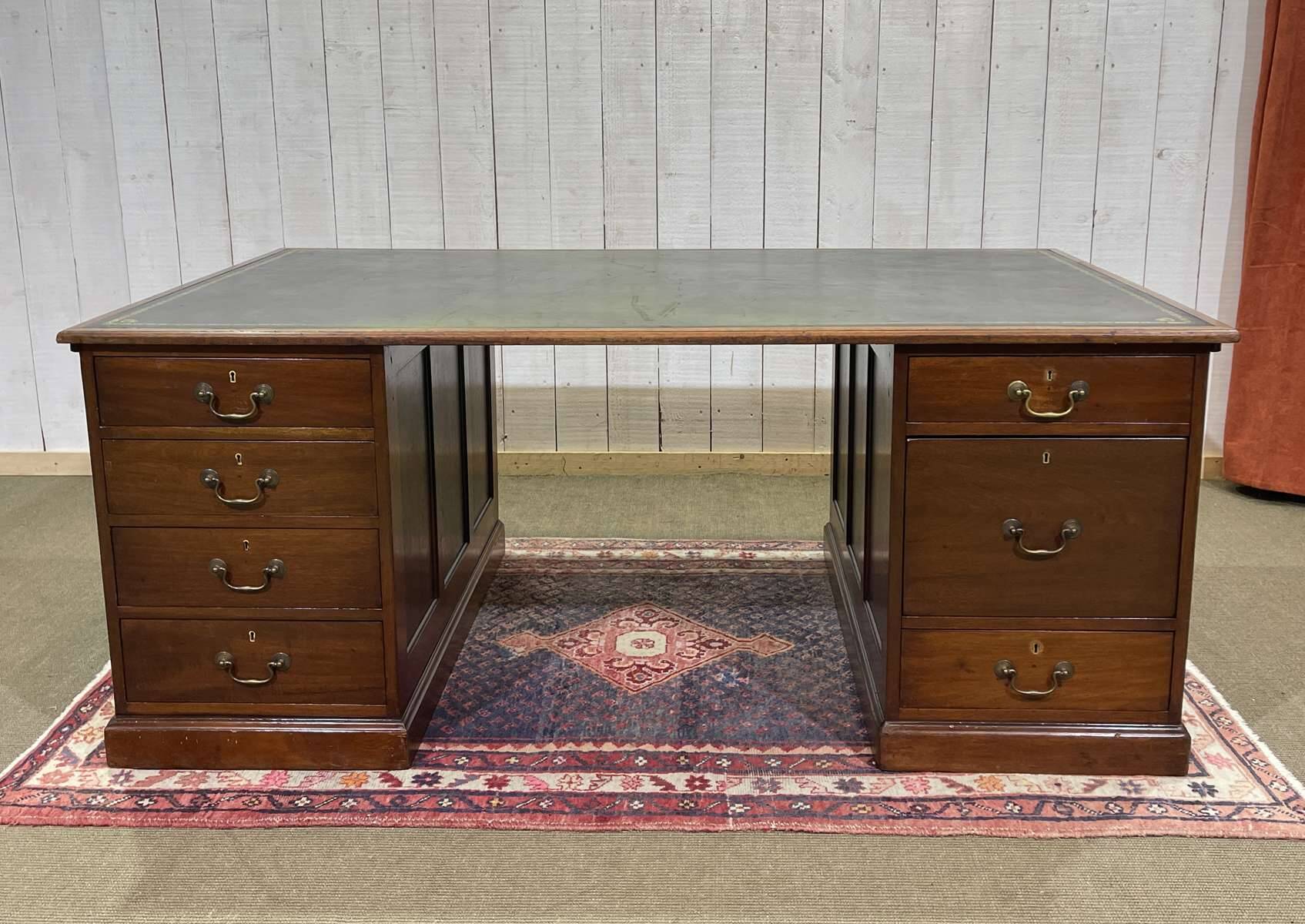 Large English flat desk in mahogany with leather top, early 20th century