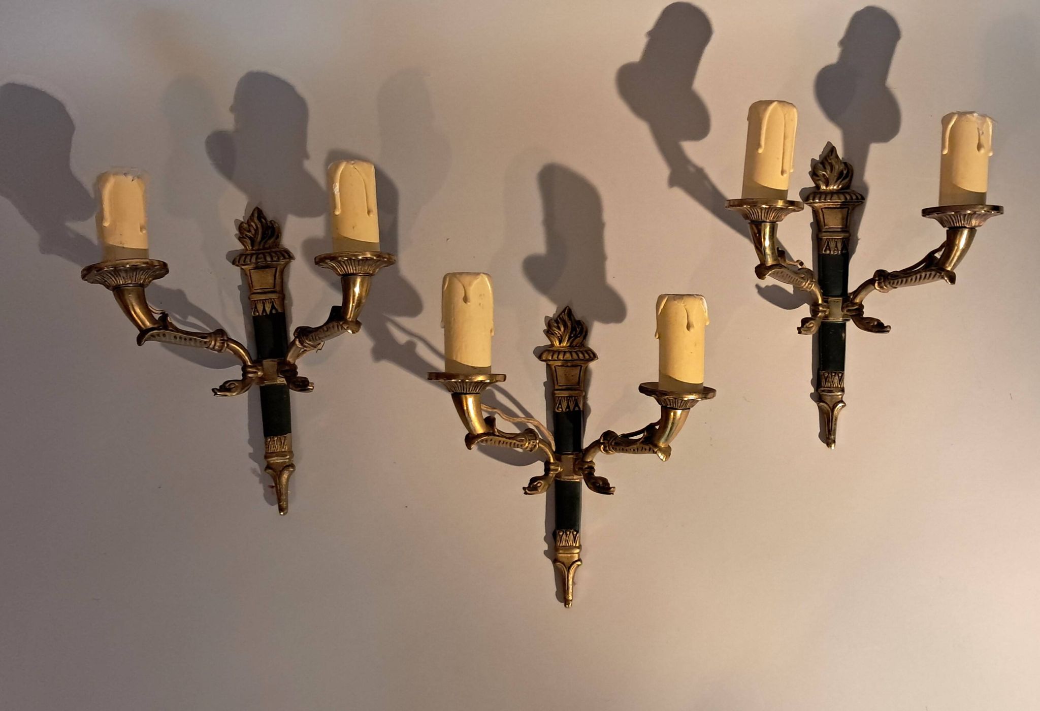 Set of 3 Empire style wall lights in bronze and gilded and green lacquered brass, Circa 1950.