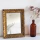 Antique mirror in gilded wood
