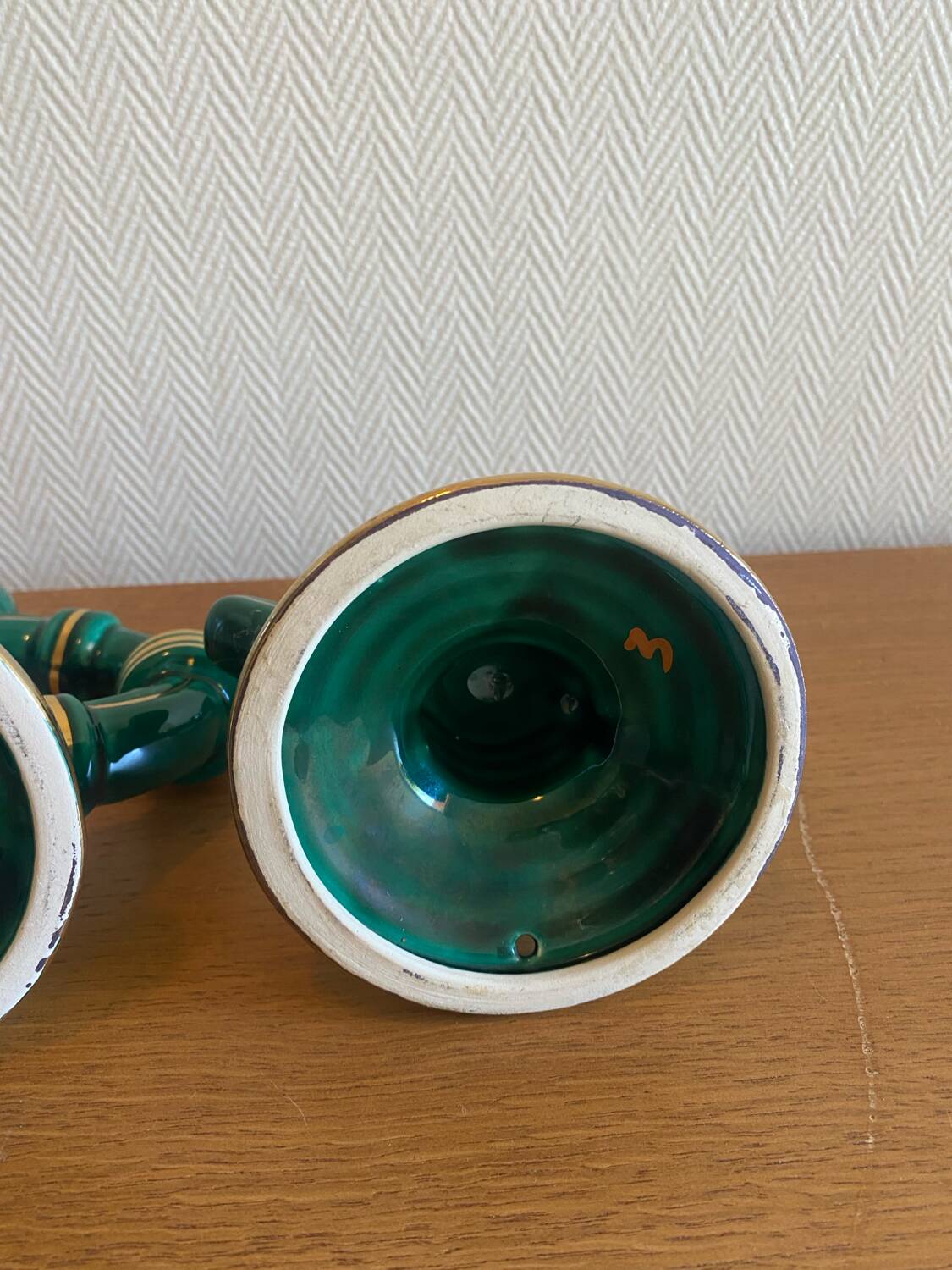 Pair of green and gold ceramic candlesticks