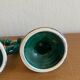 Pair of green and gold ceramic candlesticks