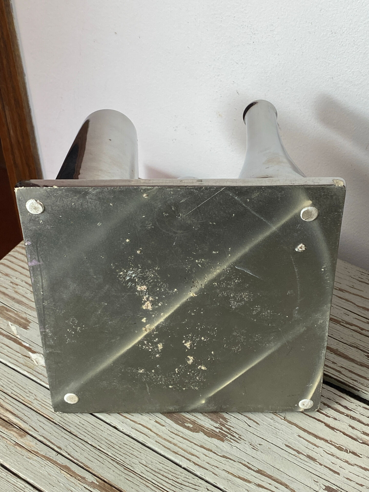 Asymmetrical multitube vase on a base, in silvered ceramic, 1970.