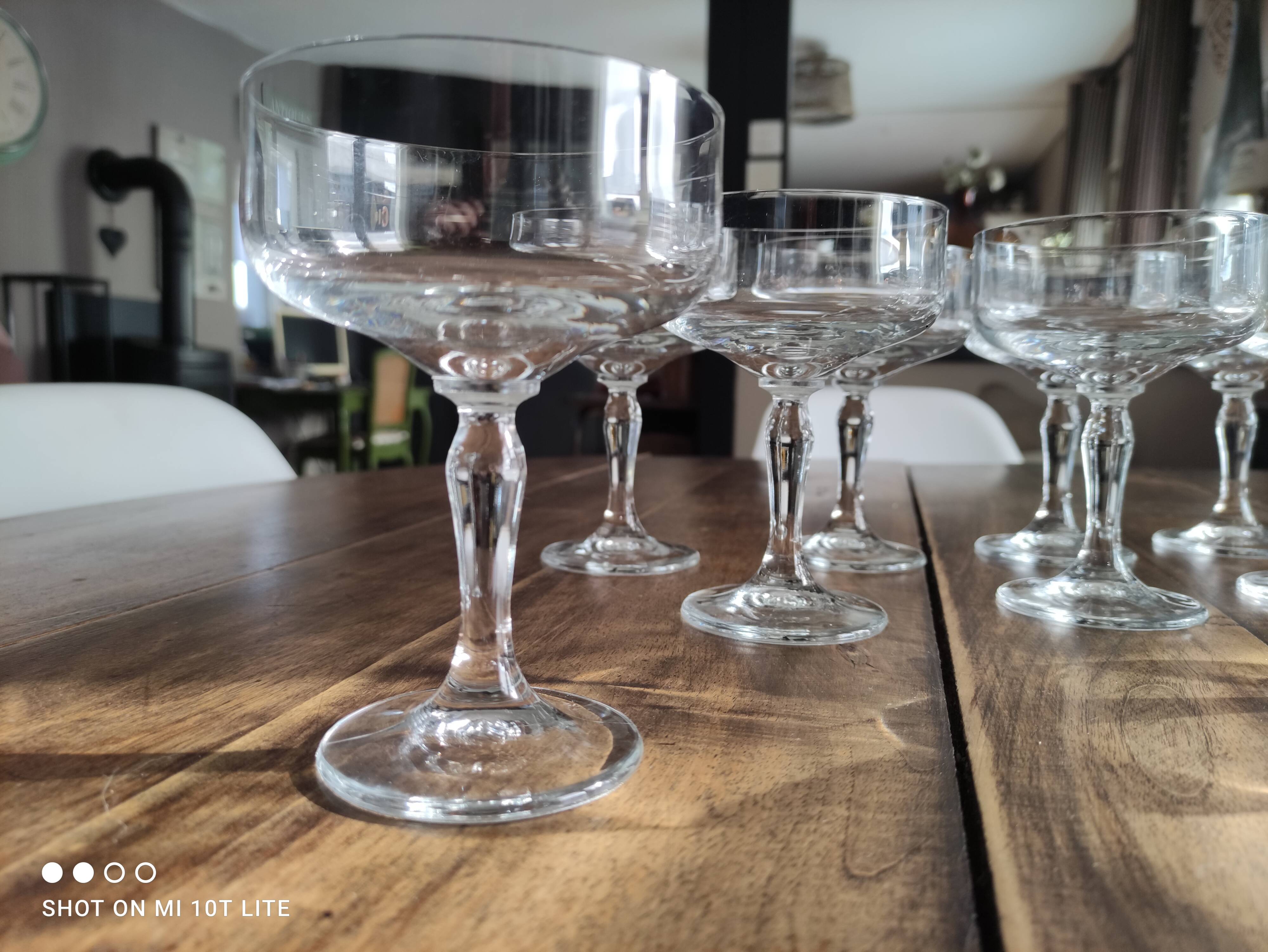 Set of 12 vintage glass champagne glasses with curved foot