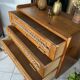 Old vintage wooden and rattan chest of drawers